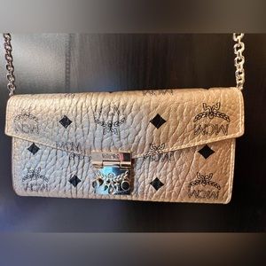 MCM Authentic
Crossbody Wallet & Chain
Canvas and leather
Gold /black MCM logo